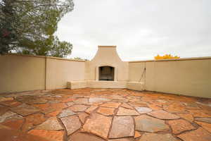 View of patio / terrace featuring a fireplace