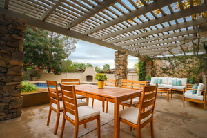 View of patio with an outdoor living space with a fireplace