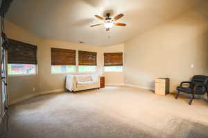 Unfurnished room featuring ceiling fan and light colored carpet