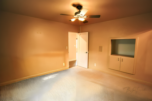 Interior space featuring ceiling fan