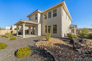 Rear view of property featuring a patio area