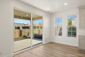 Entryway featuring light wood-type flooring and a wealth of natural light