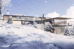 View of snow covered rear of property