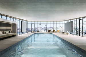 Snow covered pool with a mountain view