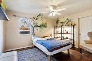 Bedroom with ceiling fan and hardwood / wood-style floors