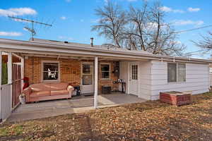 Rear view of house featuring a patio