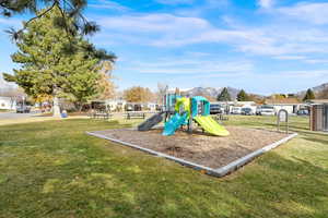 View of play area featuring a lawn and a mountain view