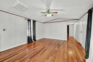 Interior space with ceiling fan and light wood-type flooring