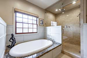 Bathroom featuring separate shower and tub