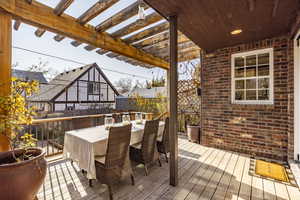 Deck featuring a pergola