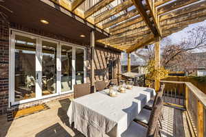 Wooden deck featuring a pergola