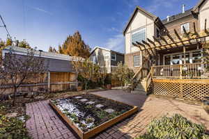 View of patio with a pergola and a wooden deck