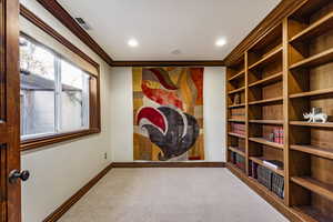 Interior space with carpet and ornamental molding