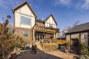 Rear view of house with a patio area, a pergola, and a deck