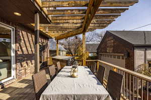 Wooden terrace featuring a pergola