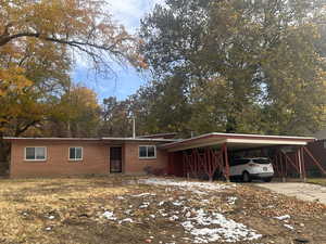 View of front of home featuring a carport