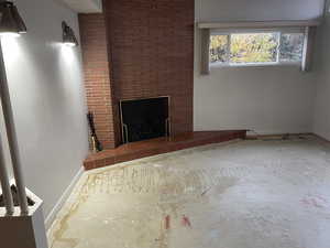 Unfurnished living room featuring a fireplace