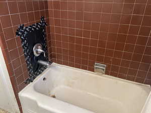 Bathroom featuring a washtub