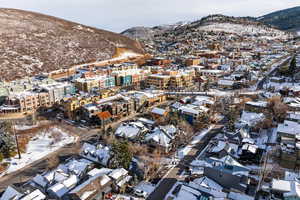 Snowy aerial view featuring a mountain view