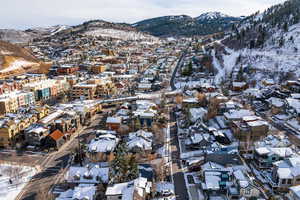 Snowy aerial view featuring a mountain view