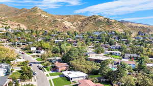 Birds eye view of property with a mountain view