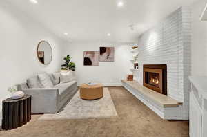 Living room featuring a classic mid century fireplace