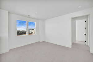 View of carpeted spare room