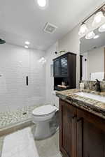 Downstairs Hall 3/4 Bath!  Brand New Subway Tile & Pebble Floor!  Euro Door in Shower!  Toilet Paper/Storage Cabinet!