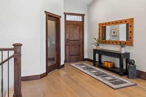 Custom Knotty Alder Entry Door with Transom Window Above.  8' Plank Hardwood Flooring!