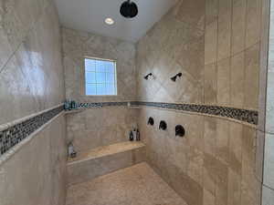 Bathroom with tiled shower