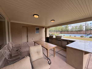 View of patio featuring area for grilling and grilling area