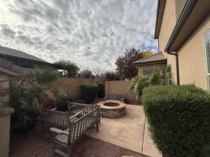 View of patio / terrace featuring an outdoor fire pit