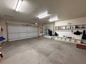 Garage with a garage door opener and water heater