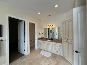 Bathroom featuring vanity and toilet