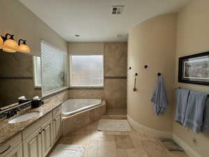 Bathroom with separate shower and tub and vanity