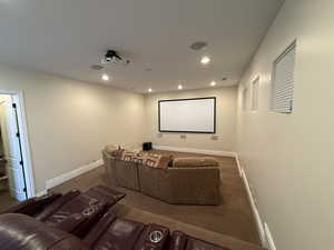 Cinema room featuring carpet flooring