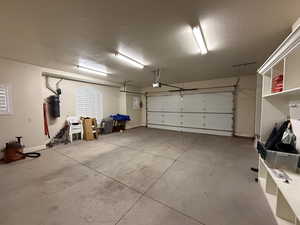 Garage featuring a garage door opener