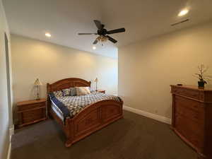 Carpeted bedroom with ceiling fan