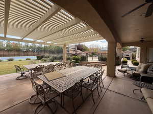 View of patio featuring a pergola and ceiling fan