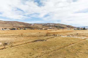 Property view of mountains featuring a rural view