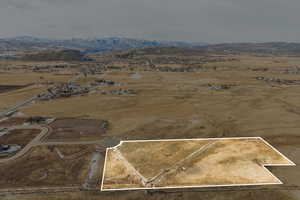 Drone / aerial view featuring a mountain view and a rural view