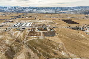 Birds eye view of property with a mountain view and a rural view