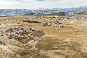 Birds eye view of property with a mountain view and a rural view