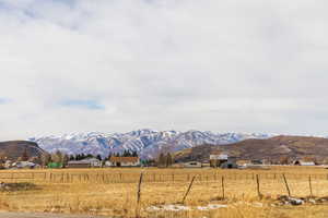 Property view of mountains featuring a rural view