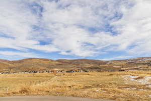 Property view of mountains with a rural view