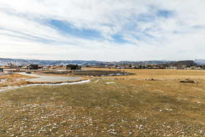 Property view of mountains with a rural view