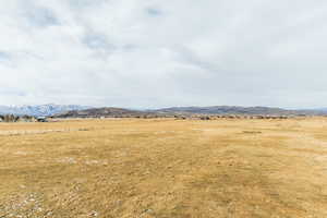 Property view of mountains with a rural view