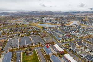 Birds eye view of property with a water and mountain view