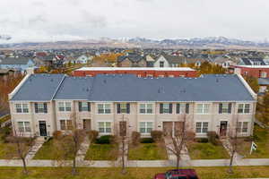 Birds eye view of property with a mountain view