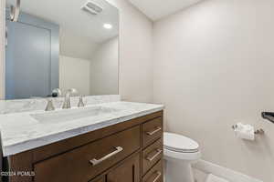 Bathroom with vanity and toilet